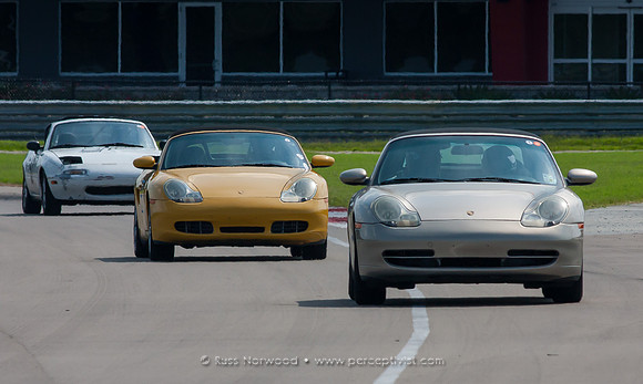 Miata chases Two Porsches